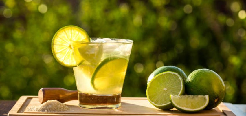 Lemon Fruit Caipirinha of Brazil on green blurry background