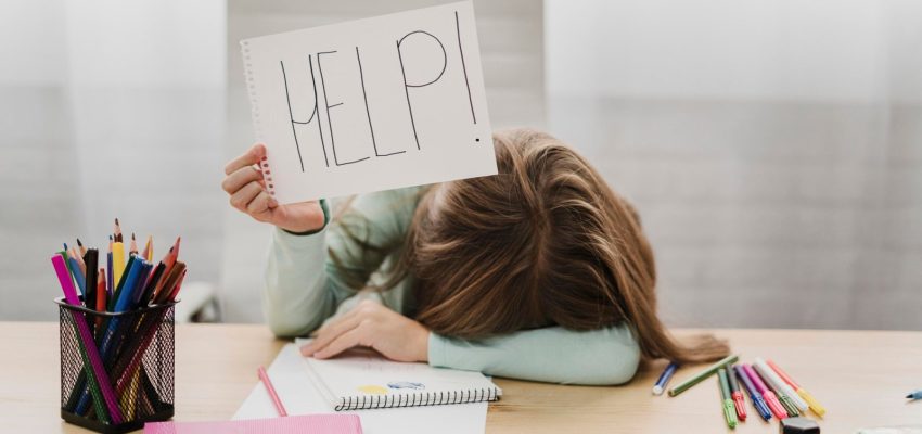 little-girl-holding-help-message-white-paper